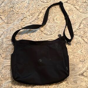 GUC Pacsafe travel shoulder bag.